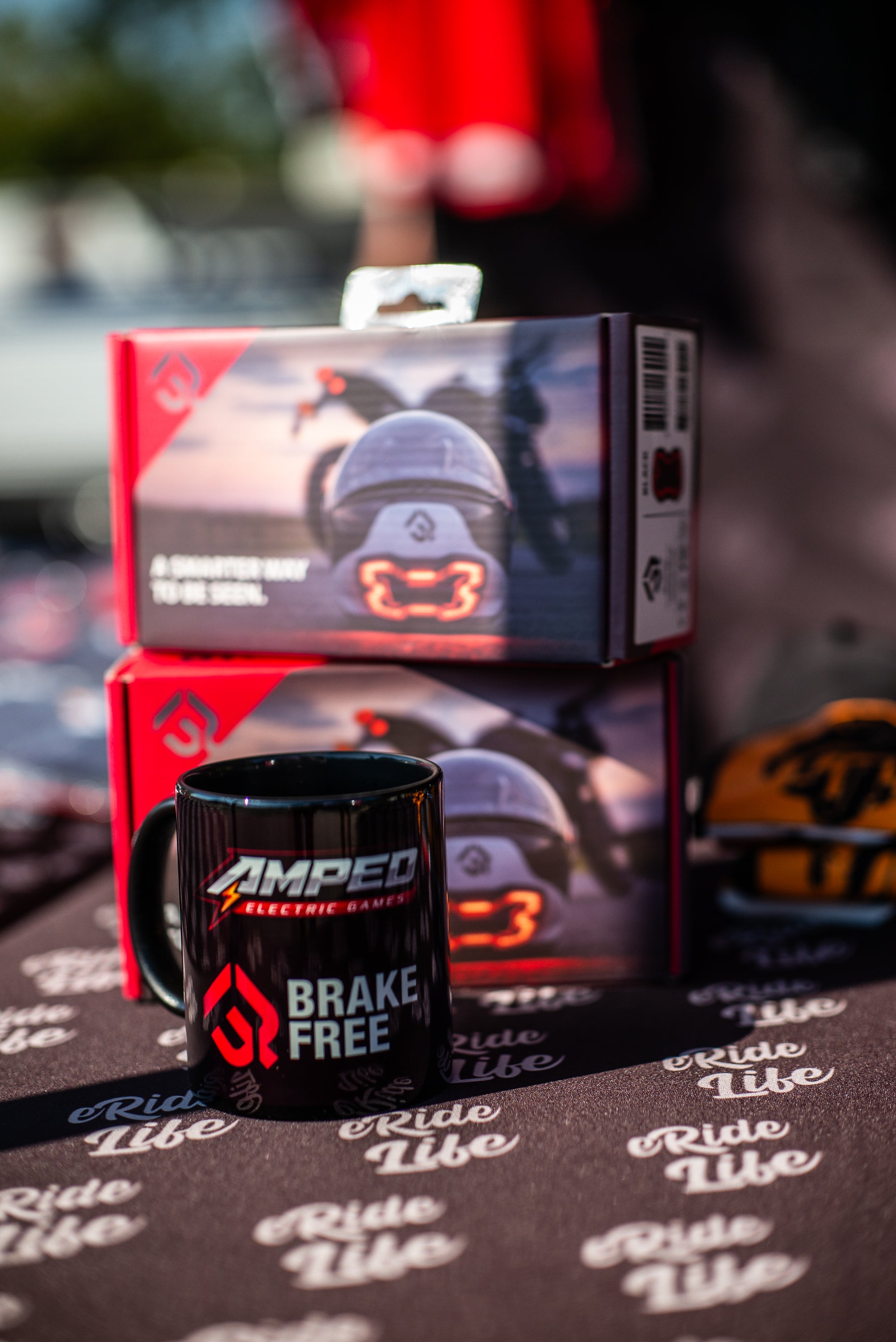 A Brake Free Unit and a mug at 2025 Amped Electric Games