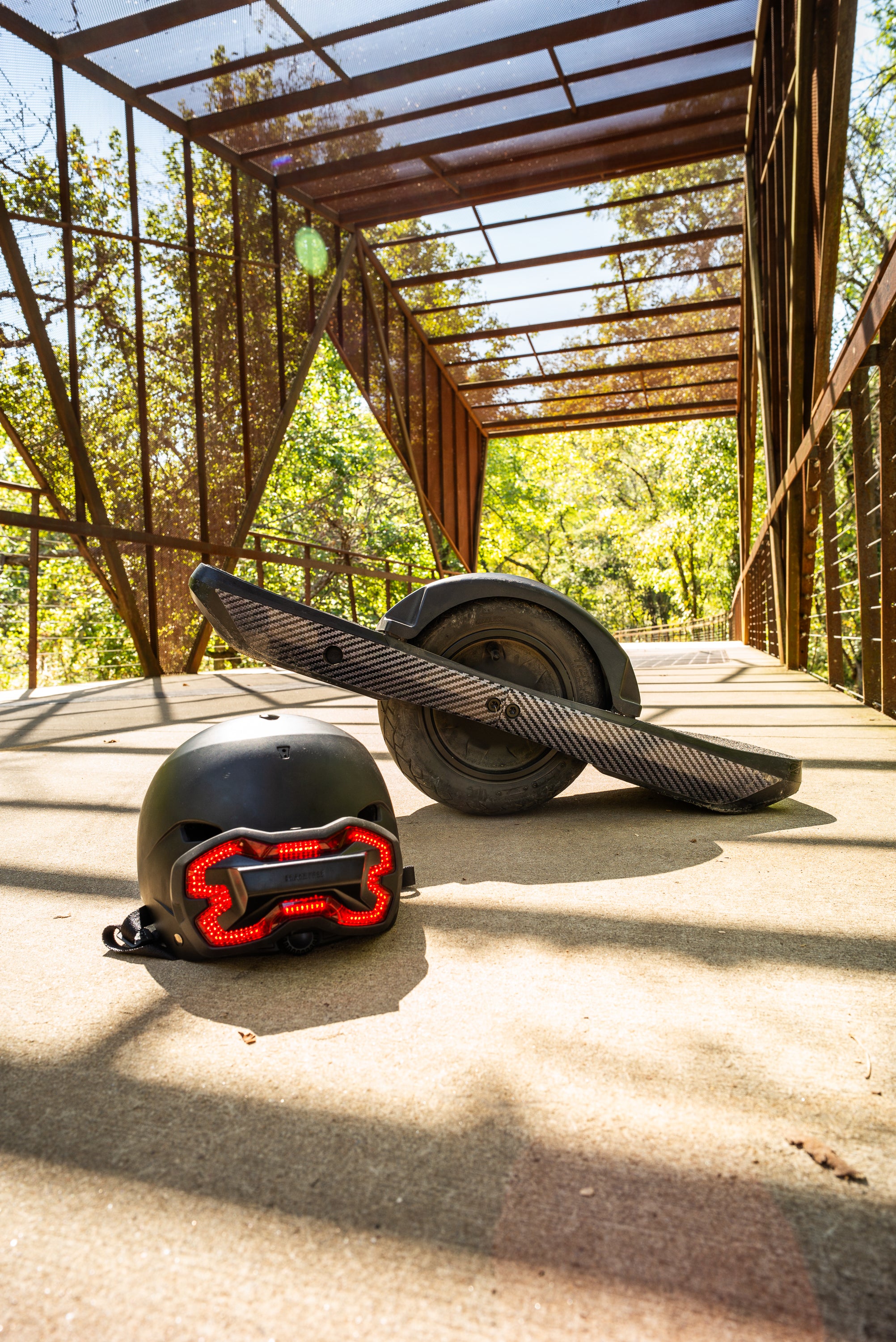 A Brake Free unit on a helmet next to a One Wheel