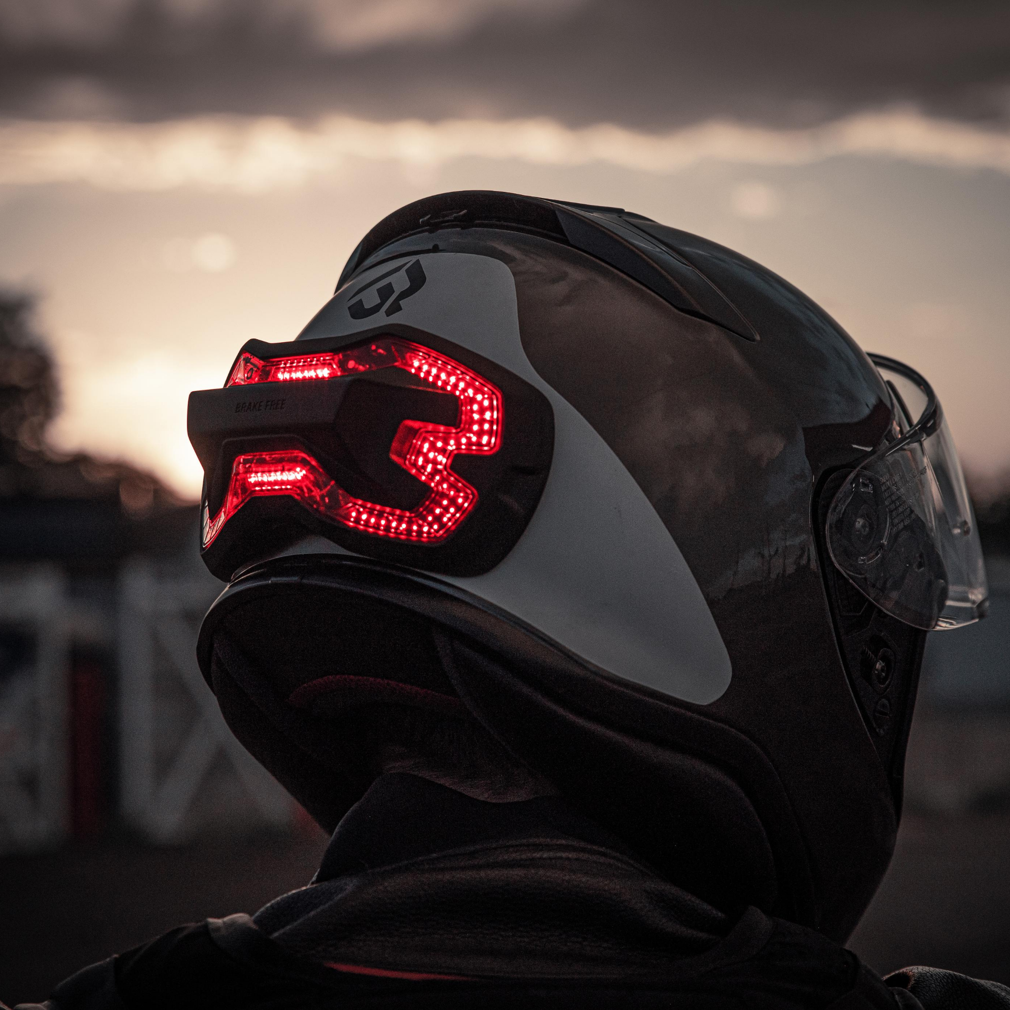 Brake Free on a Shoei RF1200 helmet. Autonomous brake light accessory for motorcycle helmets. High visibility.